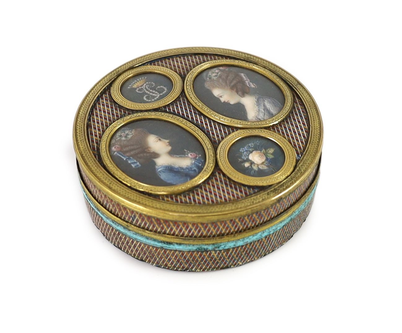 A late 18th century tortoiseshell poudre d'écaille box, the cover inset with two portraits of young ladies, below a monogram ‘JC’ with coronet, mounted in gilt metal 8cm diameter